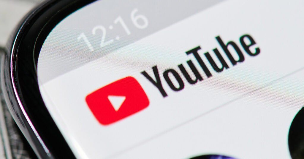 A close up of the YouTube logo on a smartphone with the WordPress plugin enabled.