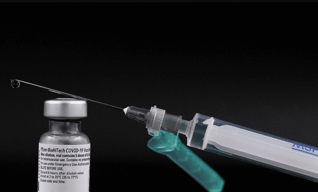A syringe is being inserted into a syringe and a discount code is applied for Planethoster or Wpvivid.