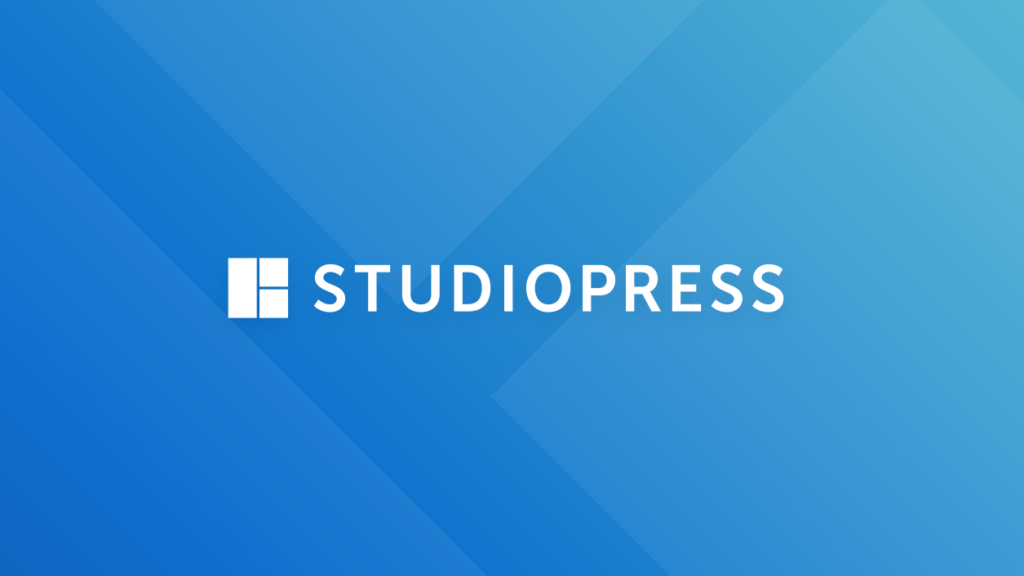 Studiopress logo with a discount code prominently displayed on a blue background.
